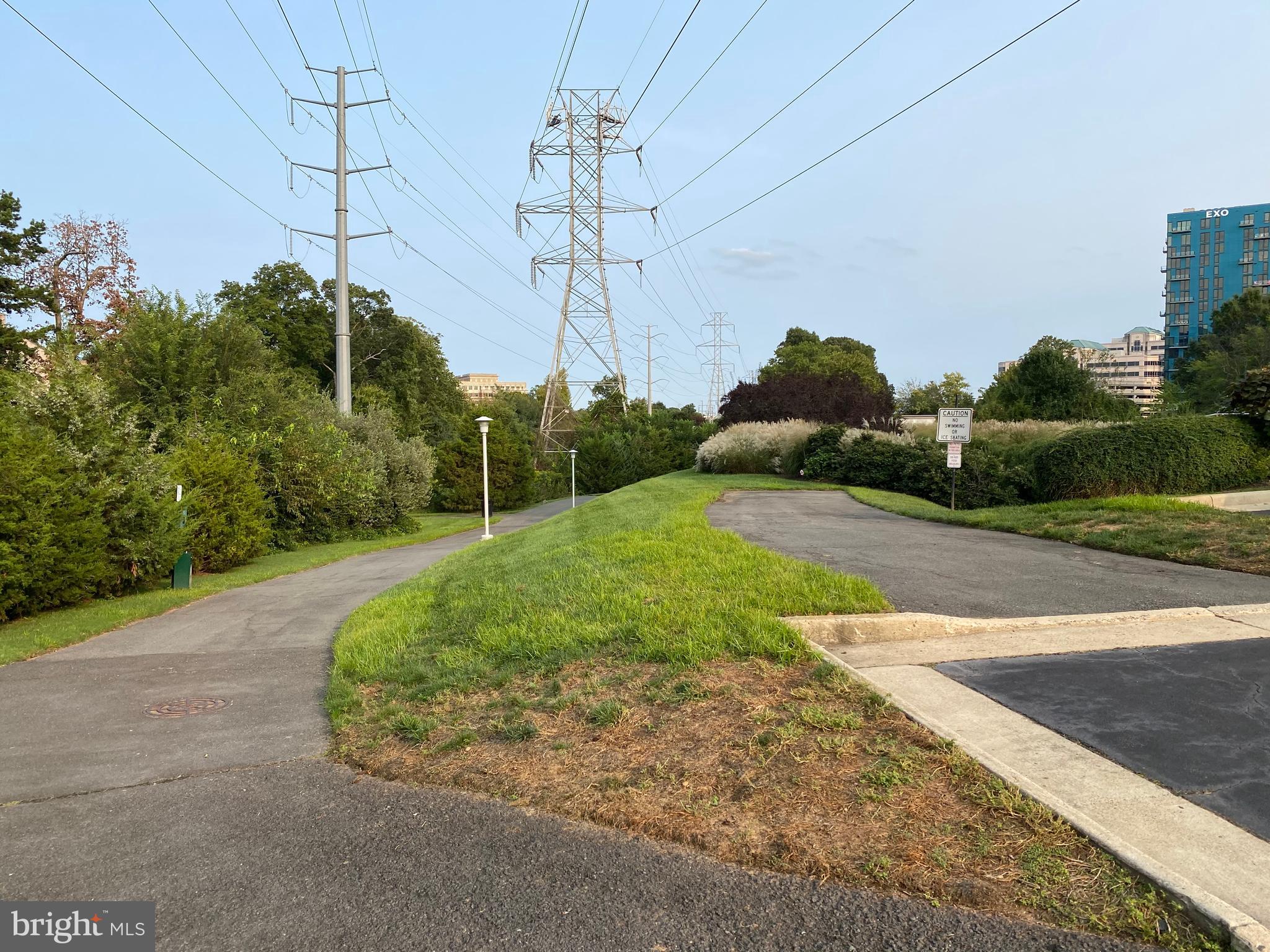11800 Sunset Hills Road, Unit 313 Reston, VA 20190 - Photo 54 of 60 Walking path to W & OD Trail from parking lot
