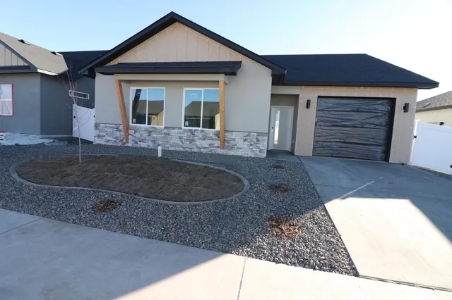 a view of a house with a tub and garage