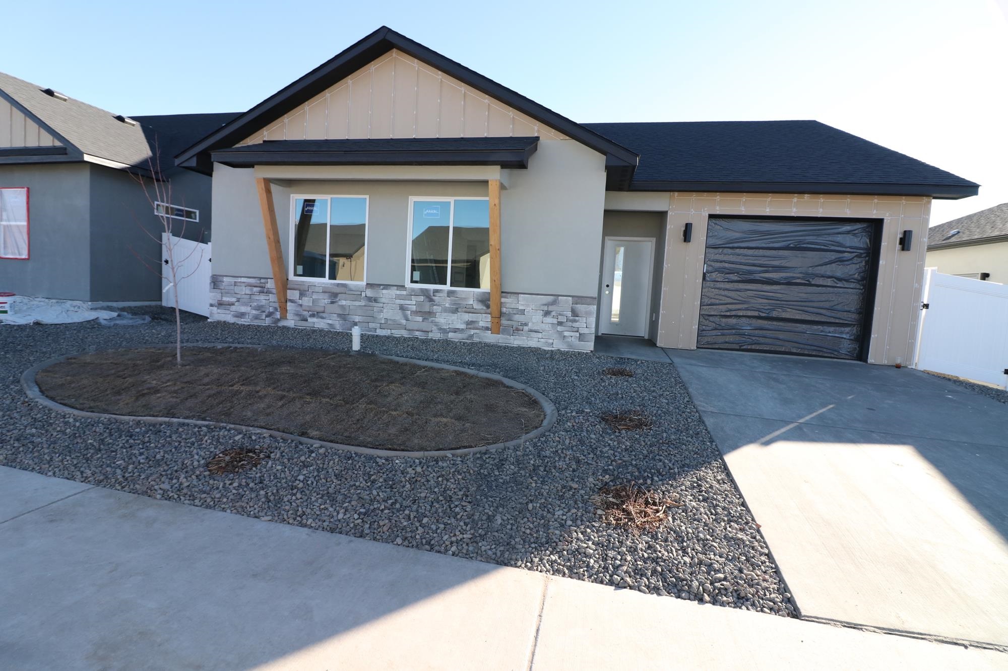 a view of a house with a tub and garage