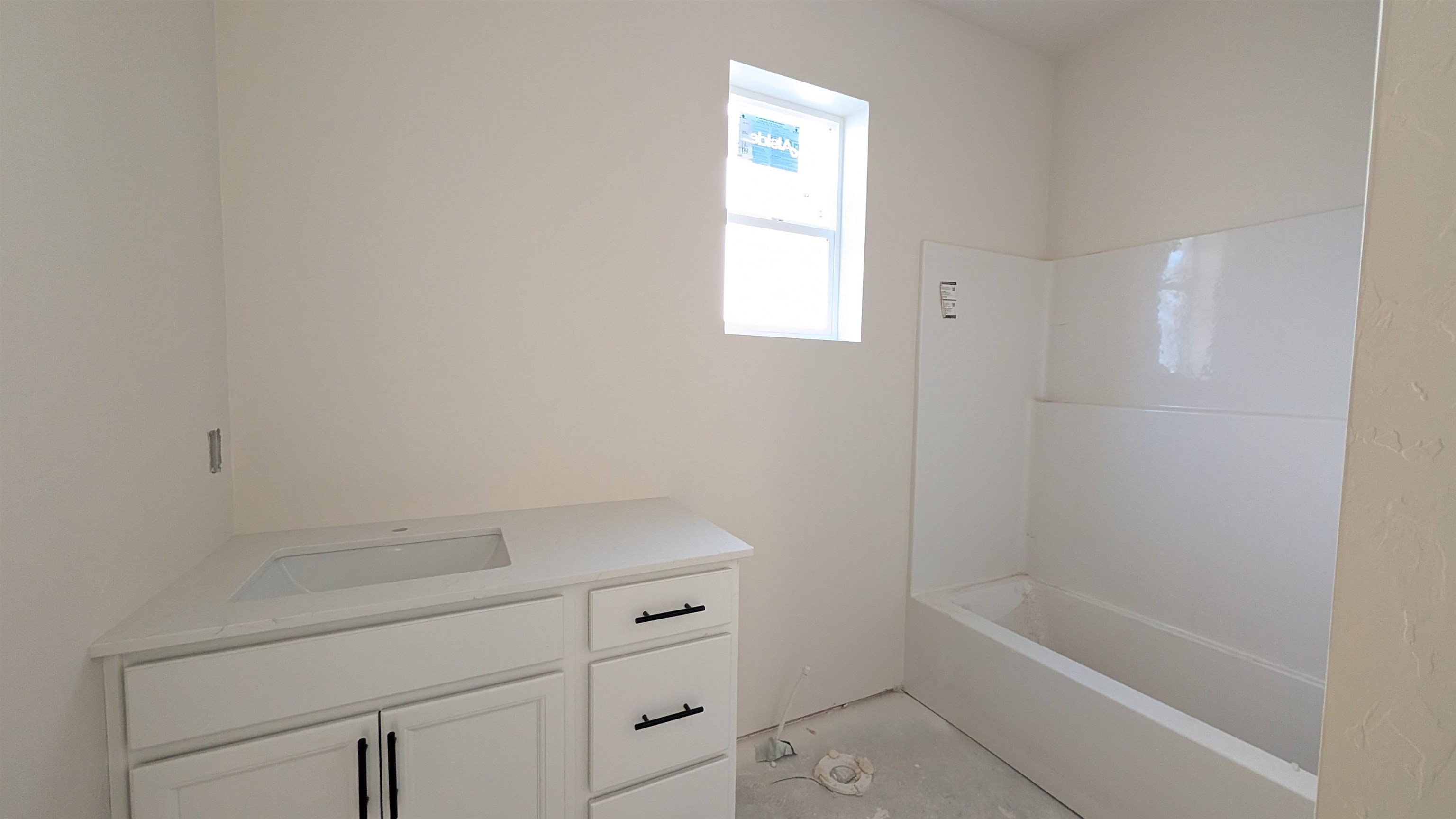 2461 Revere Road, Unit A Grand Junction, CO 81505 - Photo 7 of 15 a bathroom with a bathtub and shower