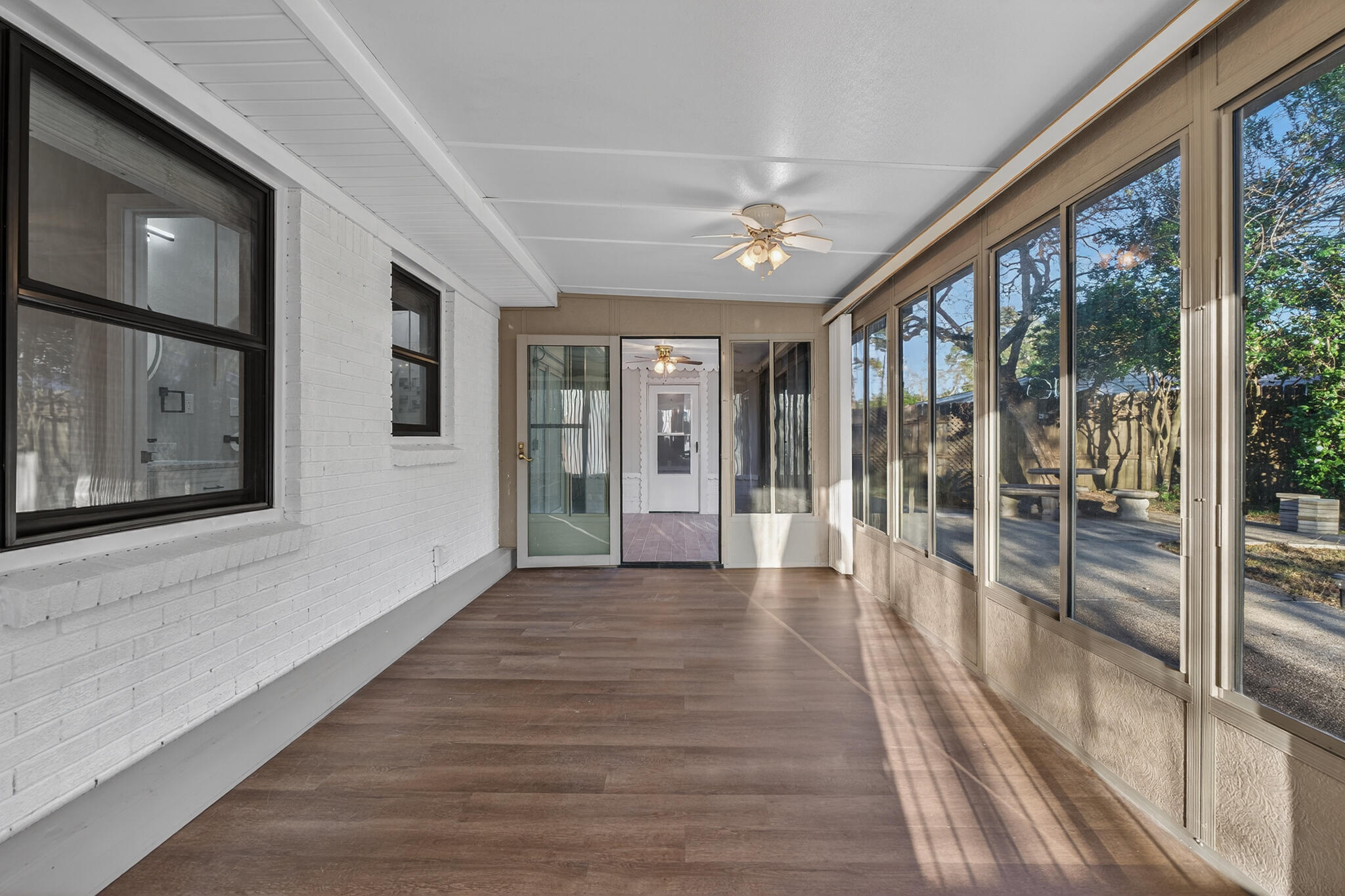 420 Paradise Road Niceville, FL 32578 - Photo 24 of 38 a view of interior space with wooden floor and windows