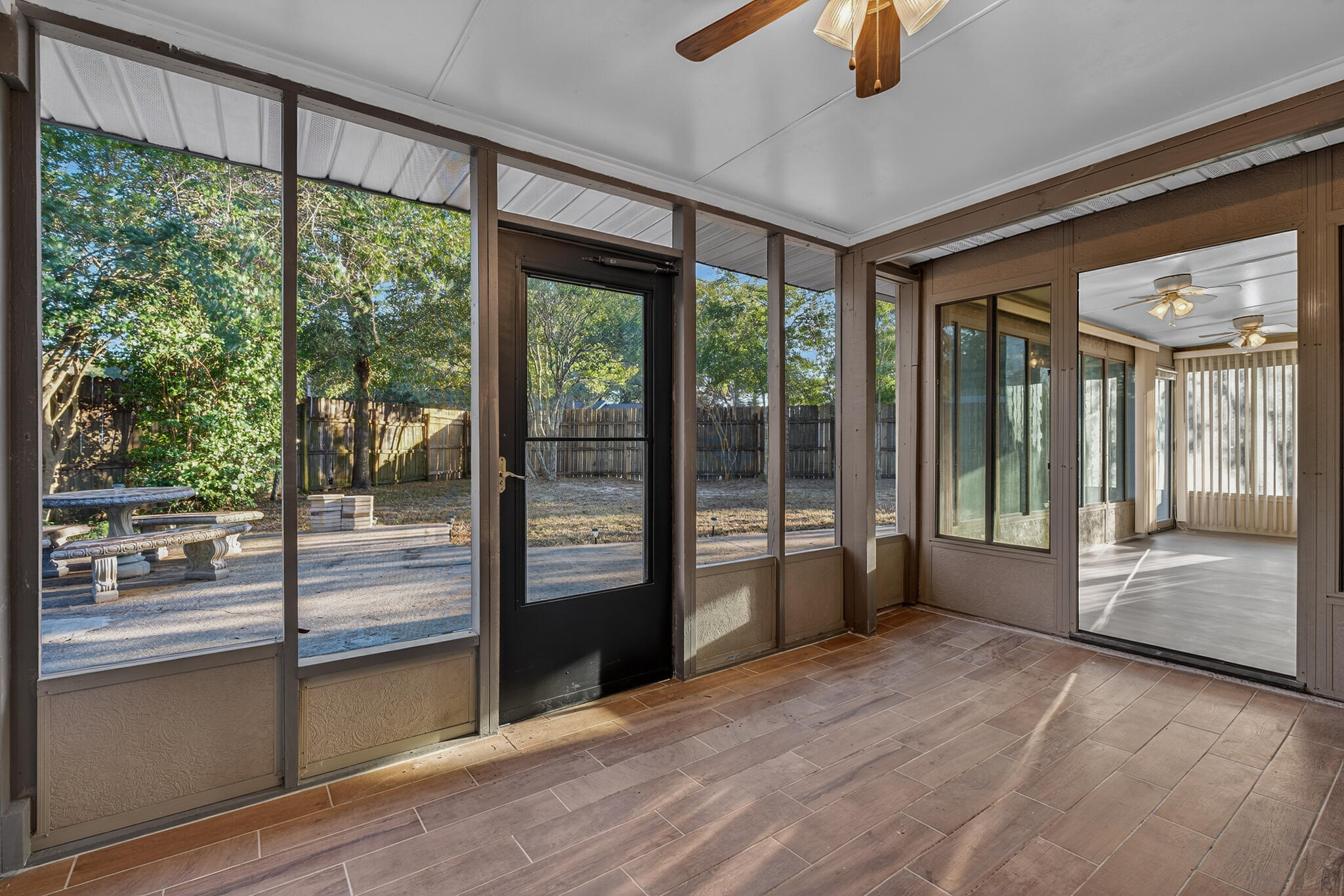 420 Paradise Road Niceville, FL 32578 - Photo 26 of 38 a view of an entryway with wooden floor and windows