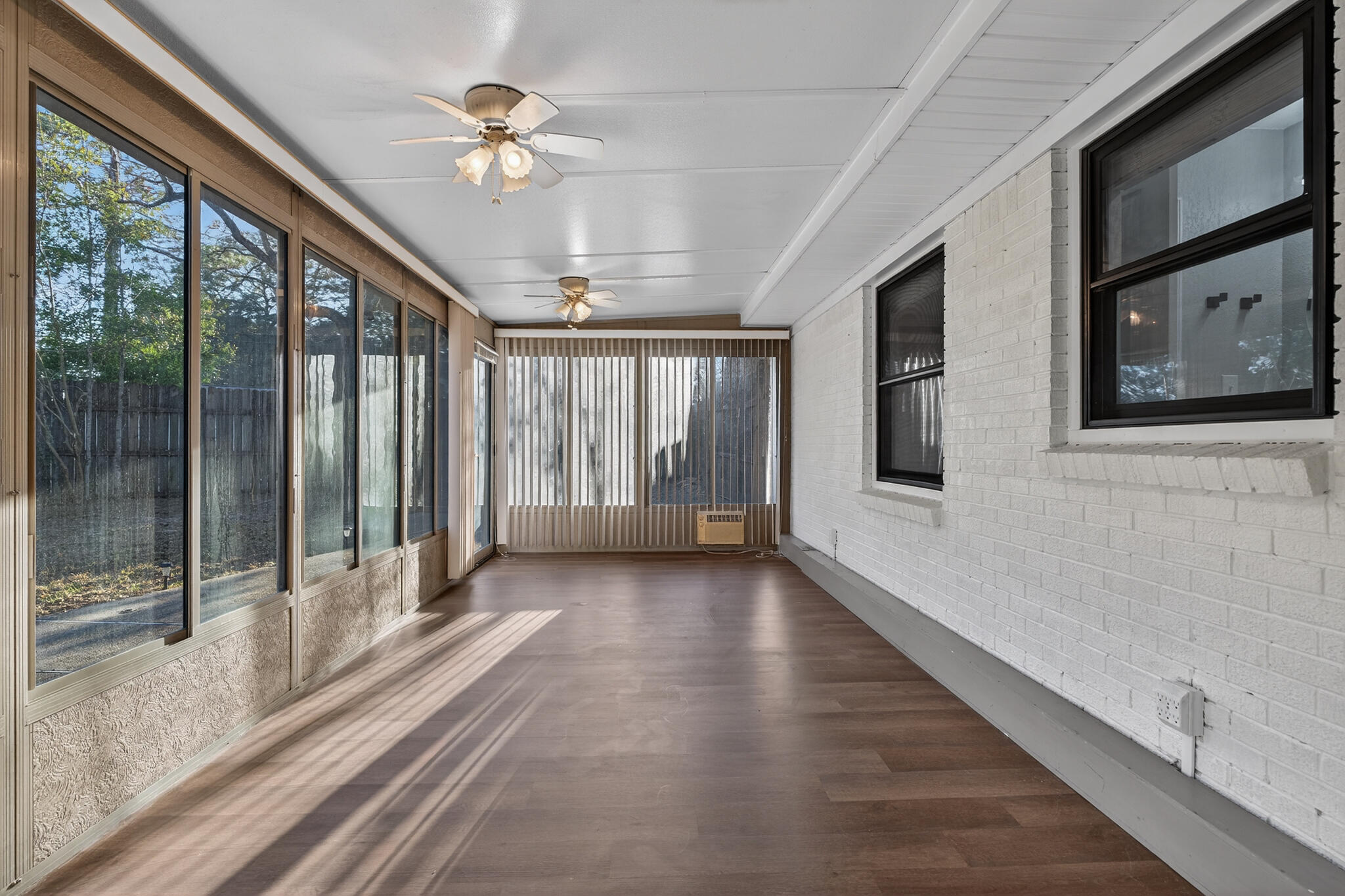 420 Paradise Road Niceville, FL 32578 - Photo 27 of 38 a view of a hall with wooden floor and a ceiling fan