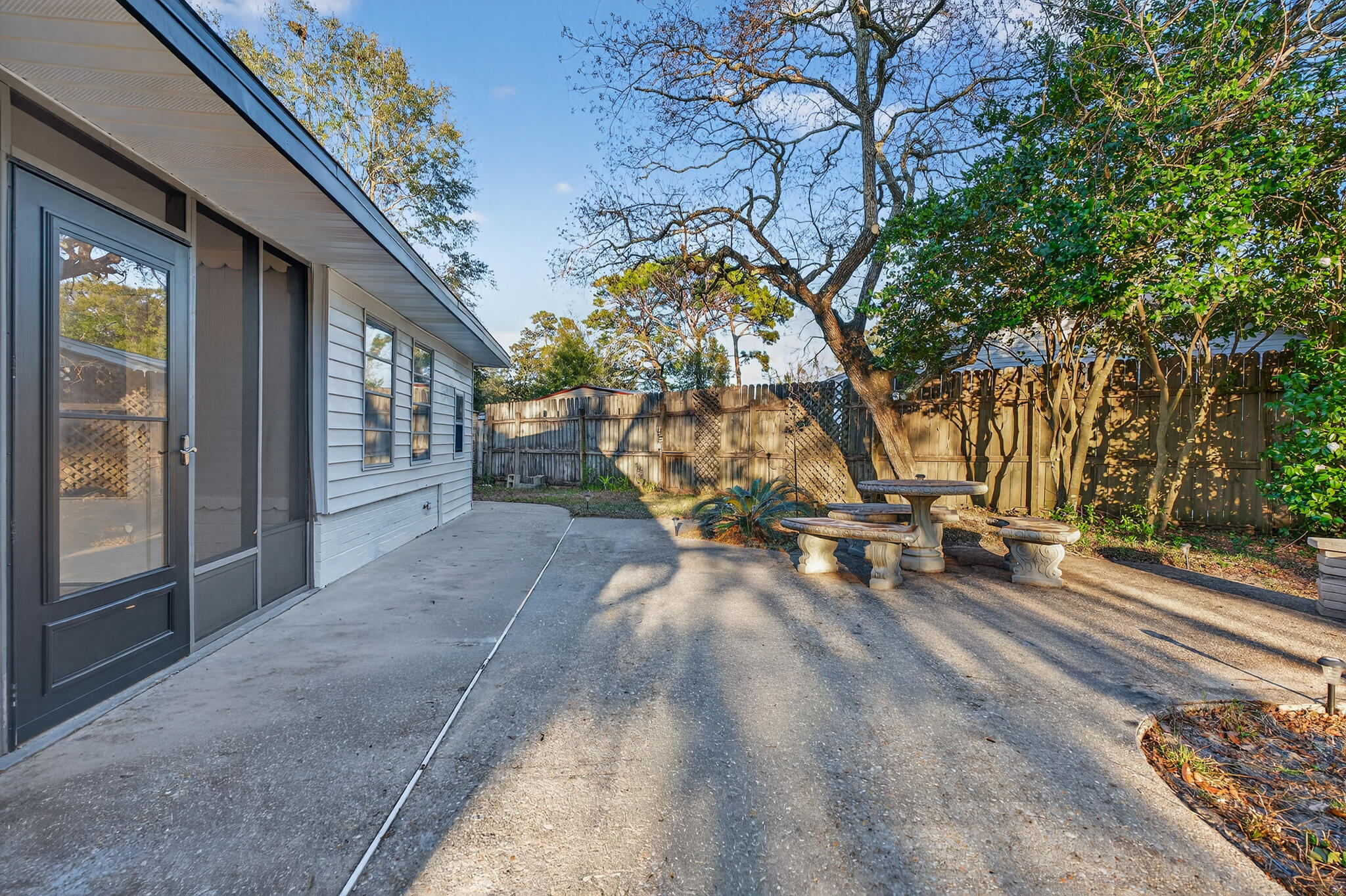 420 Paradise Road Niceville, FL 32578 - Photo 32 of 38 a view of a backyard with a large tree