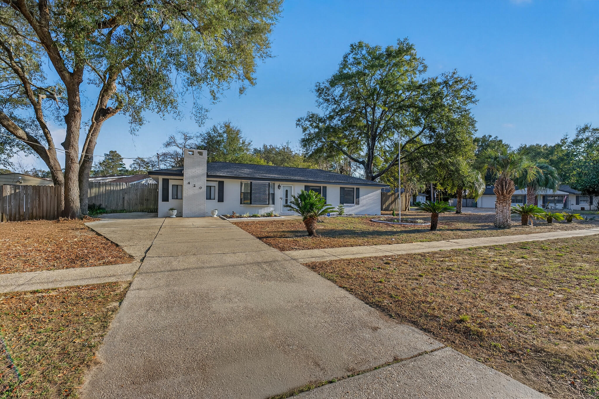 420 Paradise Road Niceville, FL 32578 - Photo 37 of 38 a view of house with outdoor space and tree s