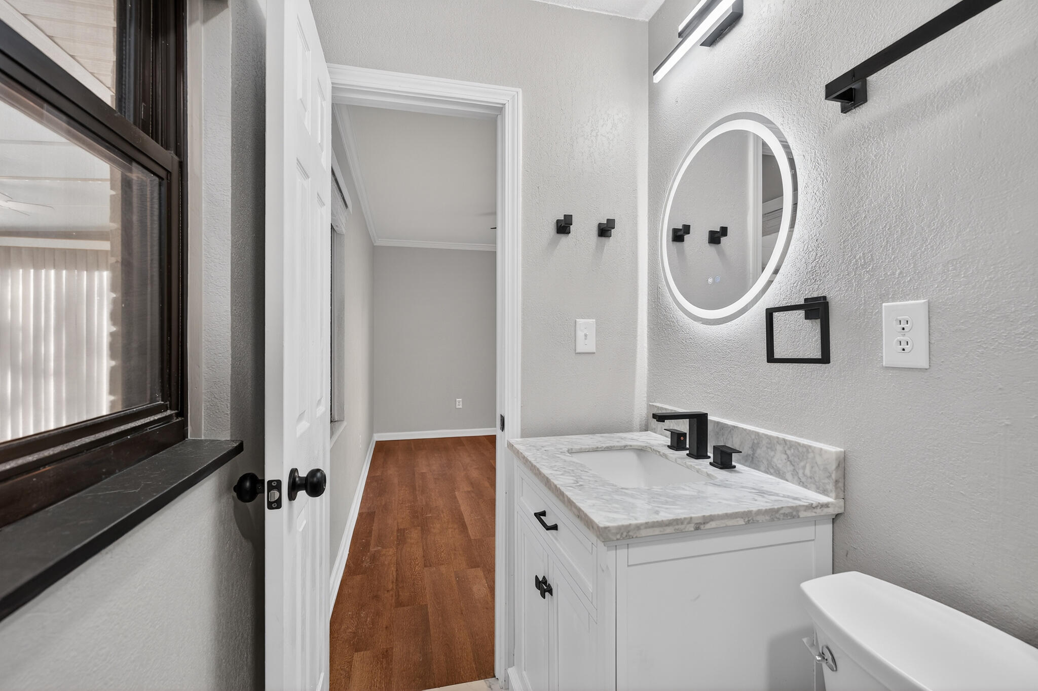 420 Paradise Road Niceville, FL 32578 - Photo 9 of 38 a bathroom with a sink a toilet and a mirror