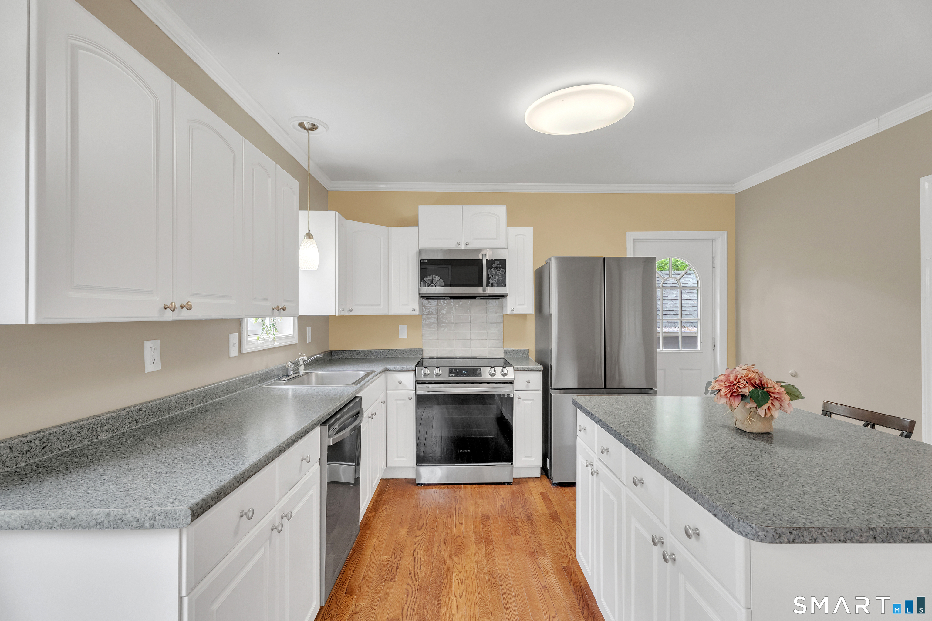 75 Summit Street Norwich, CT 06360 - Photo 18 of 40 a kitchen with stainless steel appliances granite countertop a sink stove and refrigerator