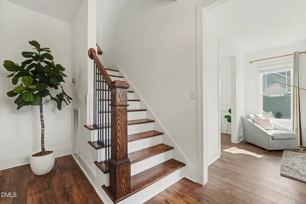 a kitchen with white cabinets stove and white appliances