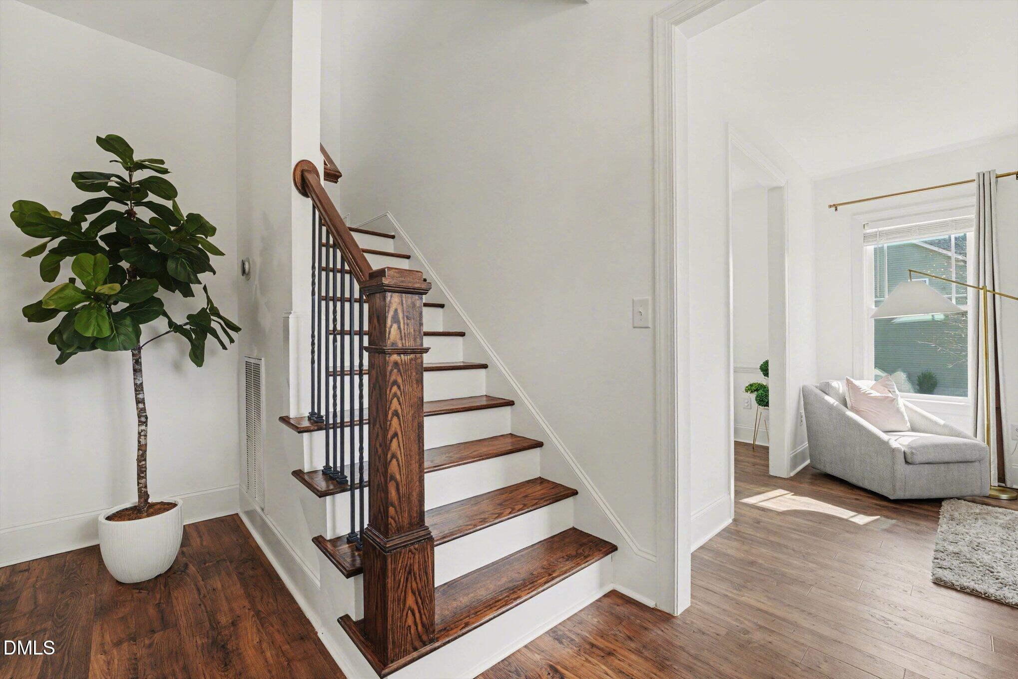 209 Timber Wolf Crossing Garner, NC 27529 - Photo 16 of 38 a view of entryway and hall with wooden floor