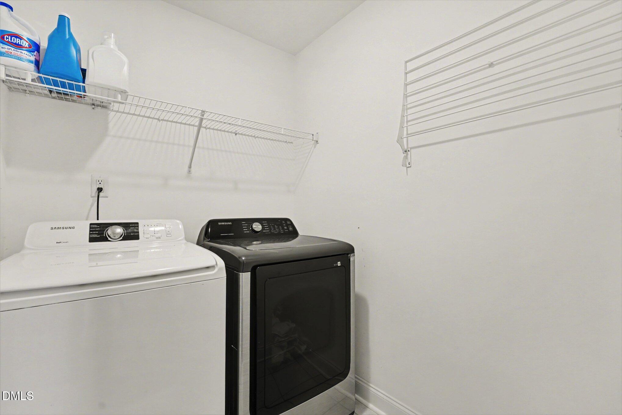 209 Timber Wolf Crossing Garner, NC 27529 - Photo 22 of 38 a utility room with dryer and washer