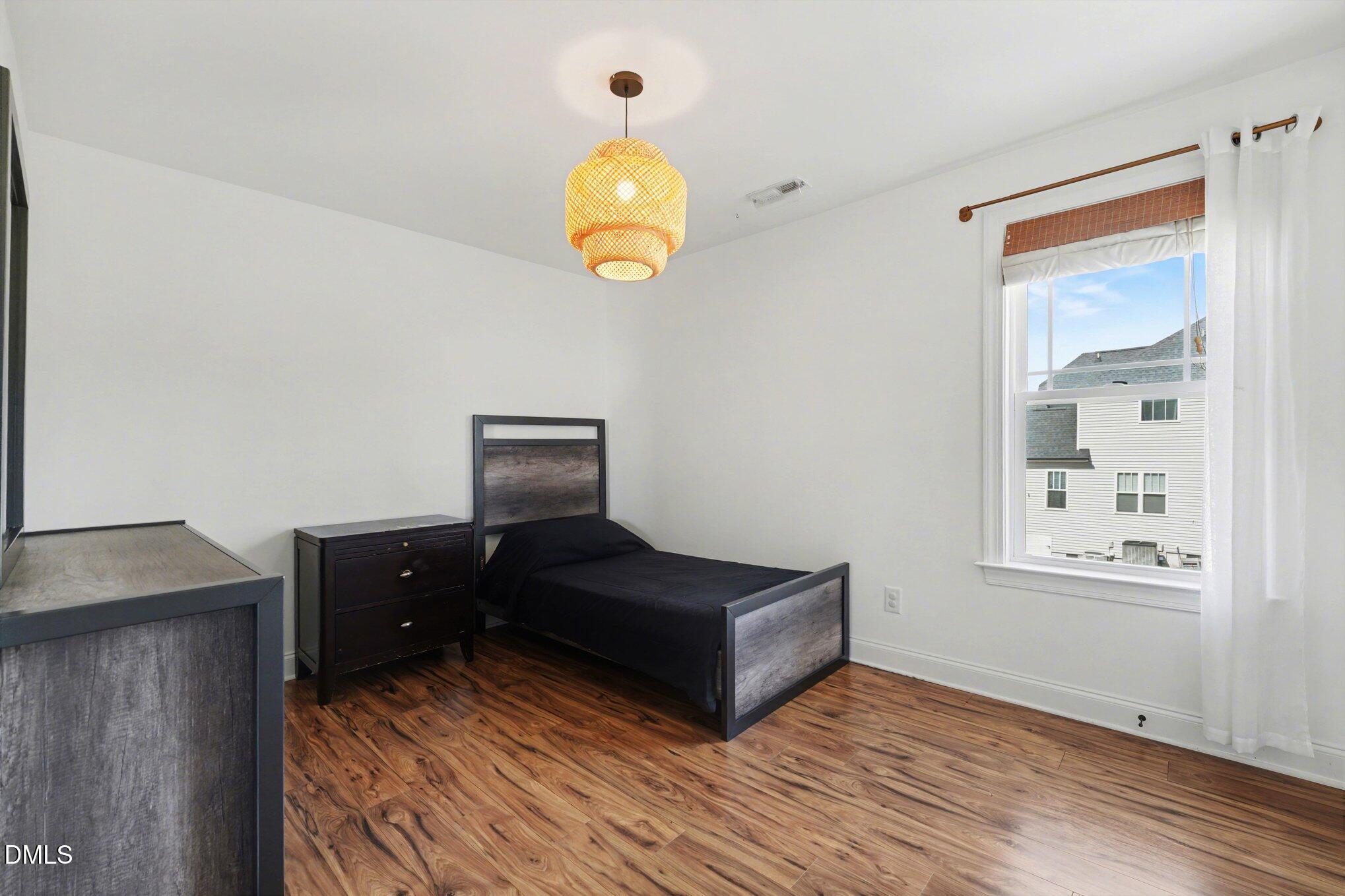 209 Timber Wolf Crossing Garner, NC 27529 - Photo 26 of 38 a bedroom with bed and window