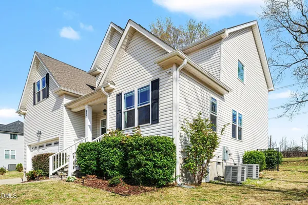 a view of a house with a street