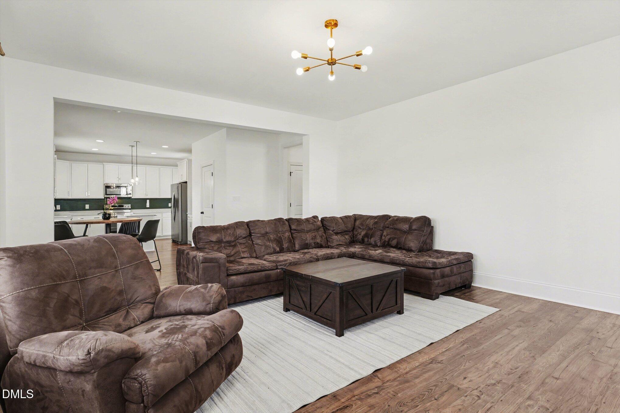 209 Timber Wolf Crossing Garner, NC 27529 - Photo 7 of 38 a living room with furniture and a couch