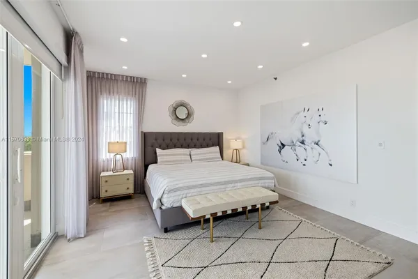 a view of a room with wooden floor and cabinet