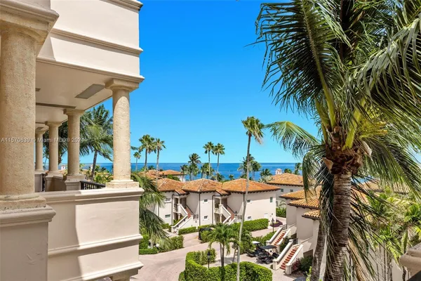 a view of a lake with a yard