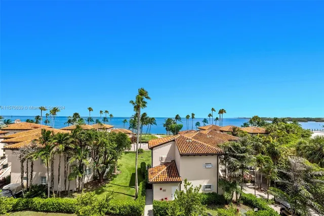 a view of an ocean and city