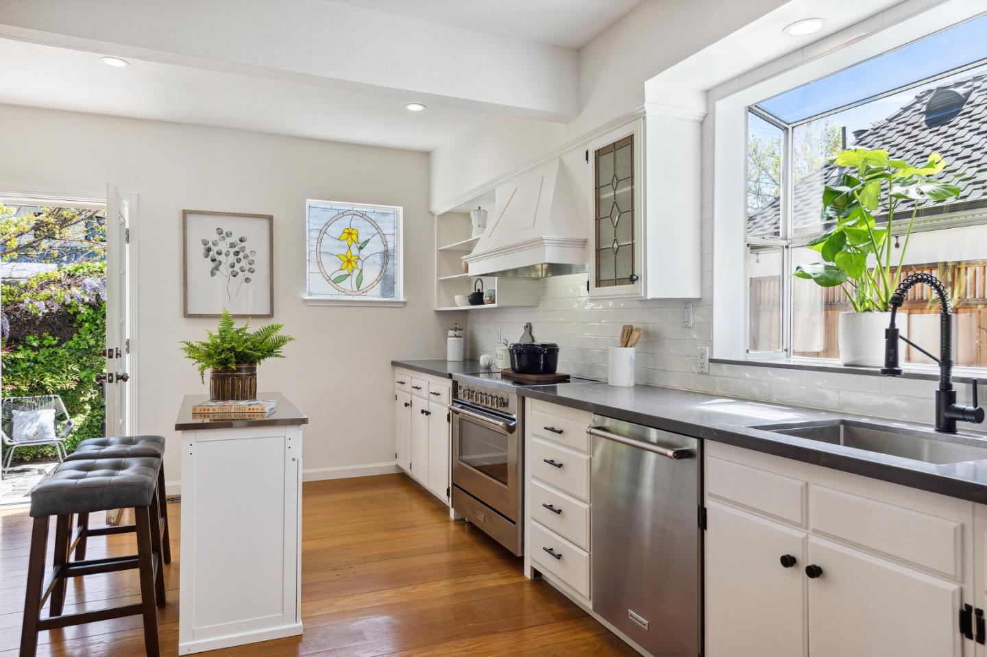 321 Bloomfield Road Burlingame, CA 94010 - Photo 16 of 45 a kitchen with stainless steel appliances a white cabinets stove and a window
