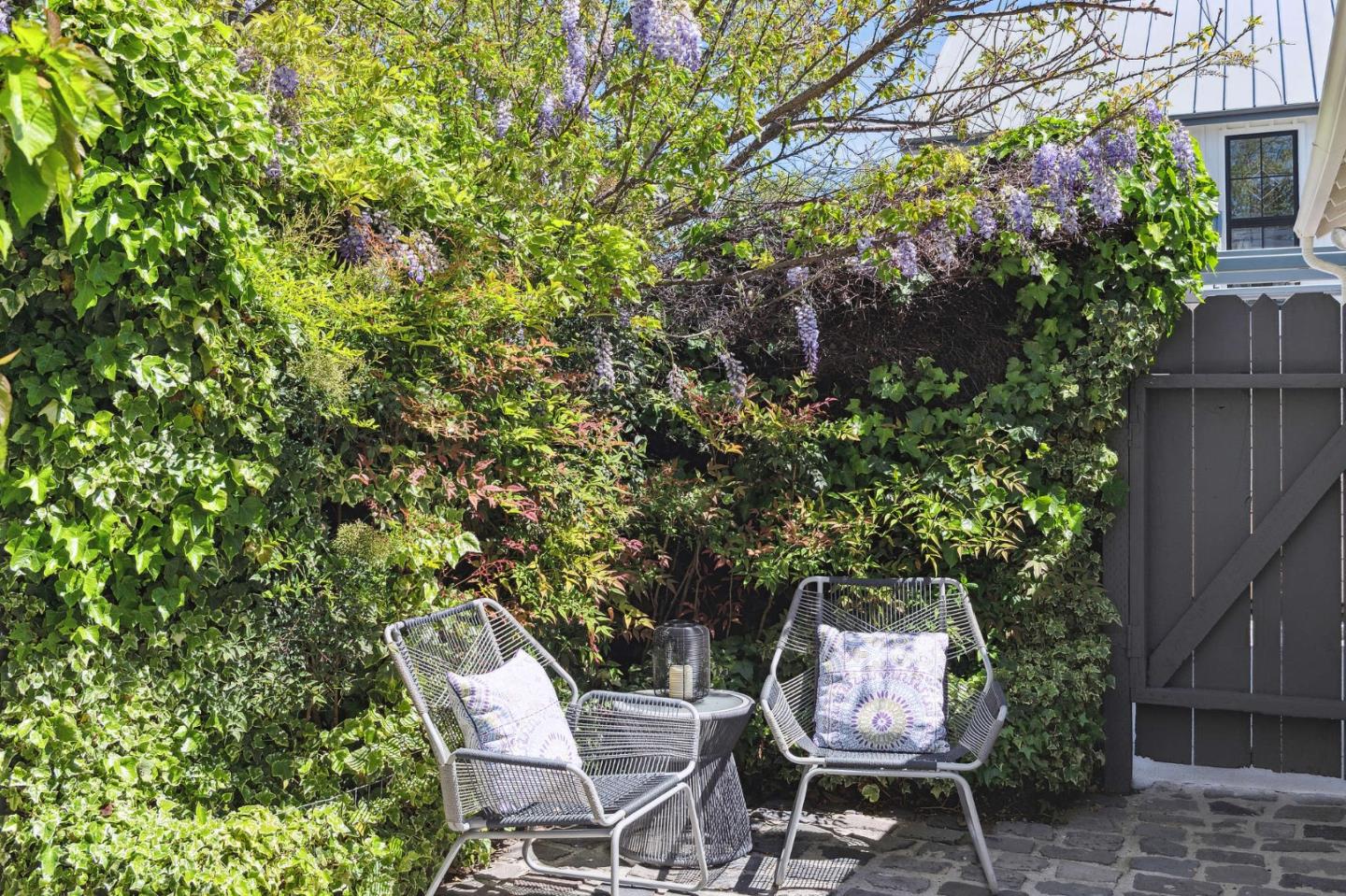 321 Bloomfield Road Burlingame, CA 94010 - Photo 39 of 45 a backyard with table and chairs and potted plants