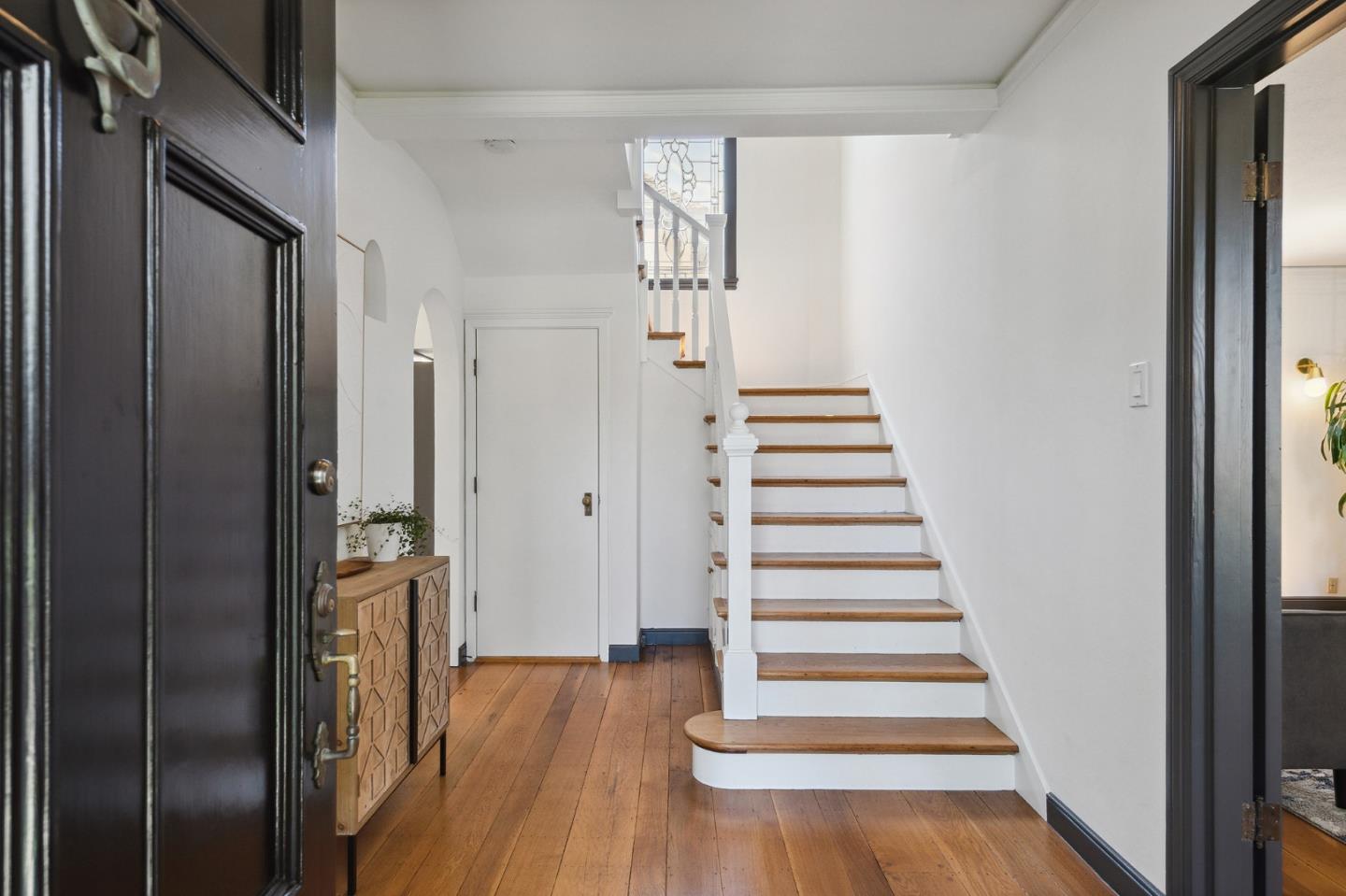 321 Bloomfield Road Burlingame, CA 94010 - Photo 4 of 45 a view of a hallway with wooden floor and windows