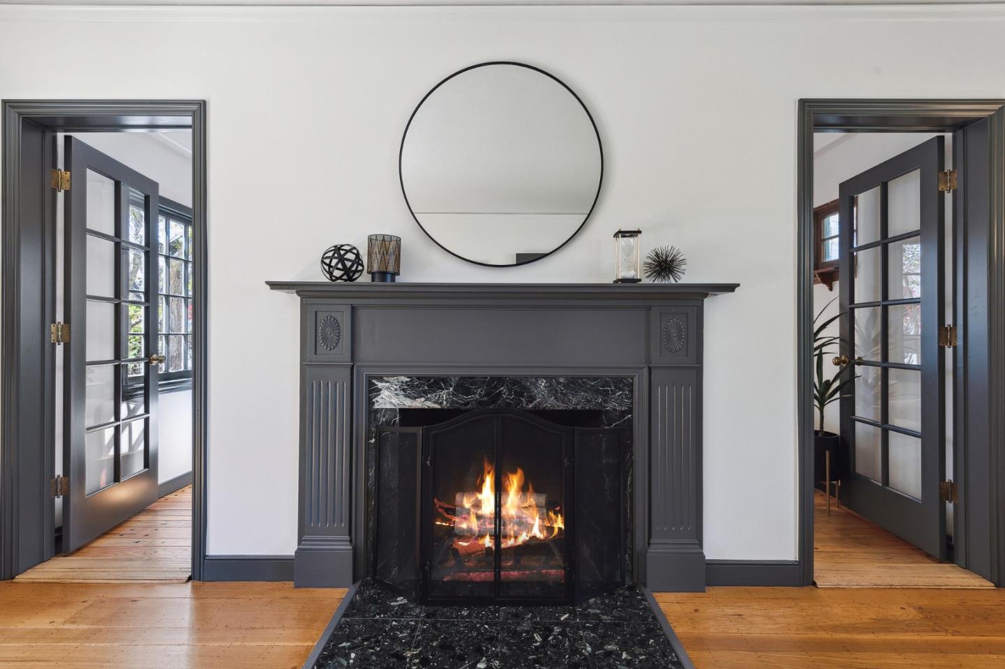 321 Bloomfield Road Burlingame, CA 94010 - Photo 6 of 45 a living room with a fireplace and a wooden floor