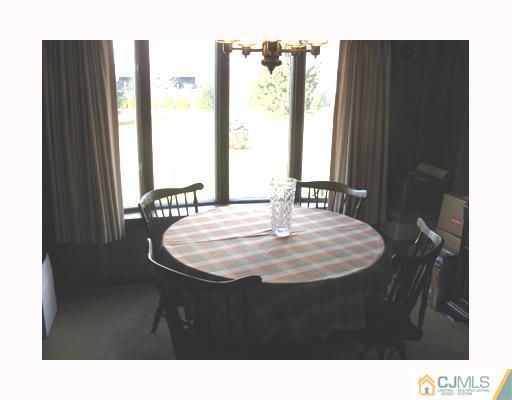 856 Ridge Road Monmouth Junction, NJ 08852 - Photo 4 of 7 a black and white photo of a room