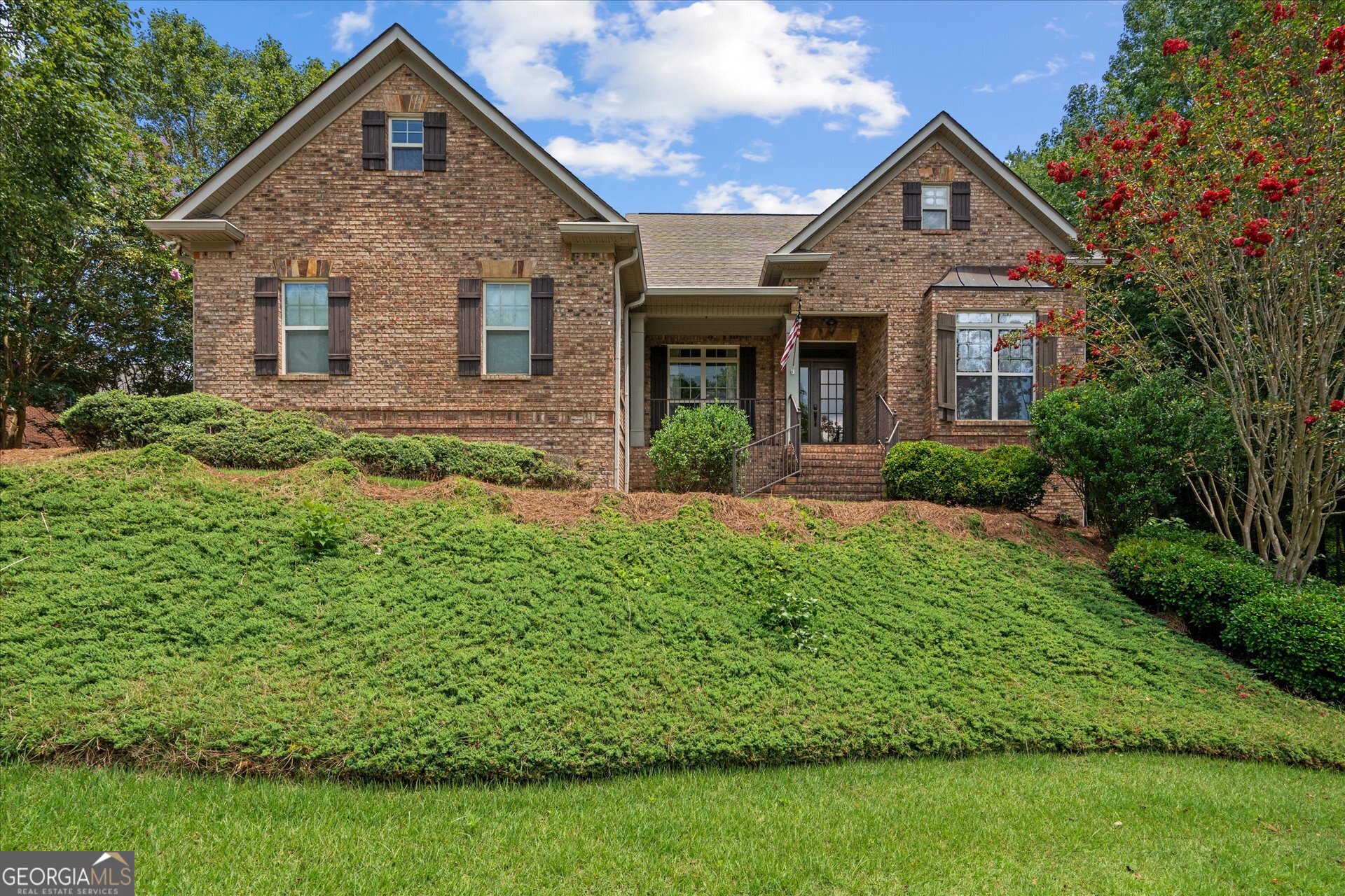 a front view of a house with a yard