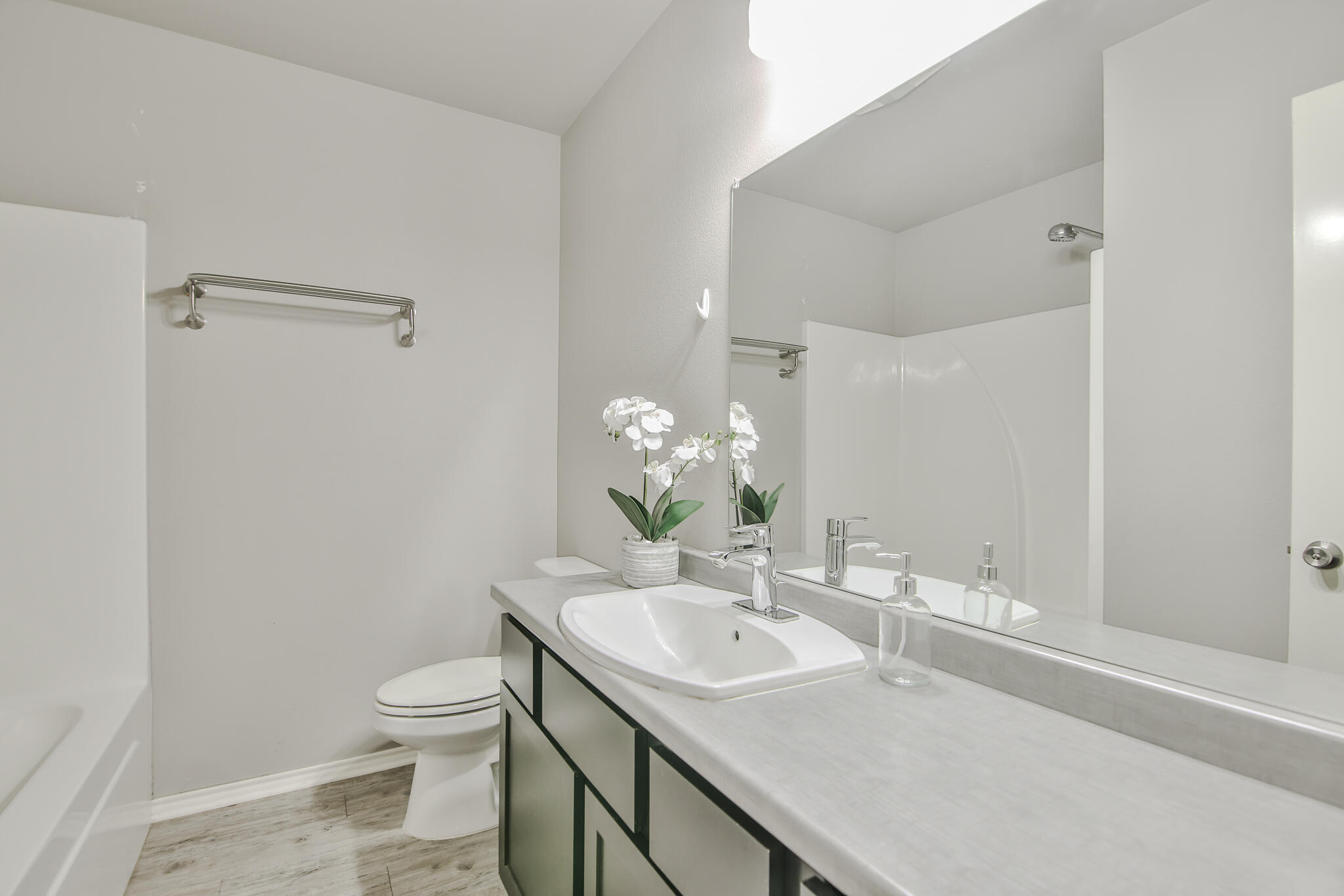 6205 21st Street Lubbock, TX 79407 - Photo 16 of 22 a bathroom with a sink toilet and shower