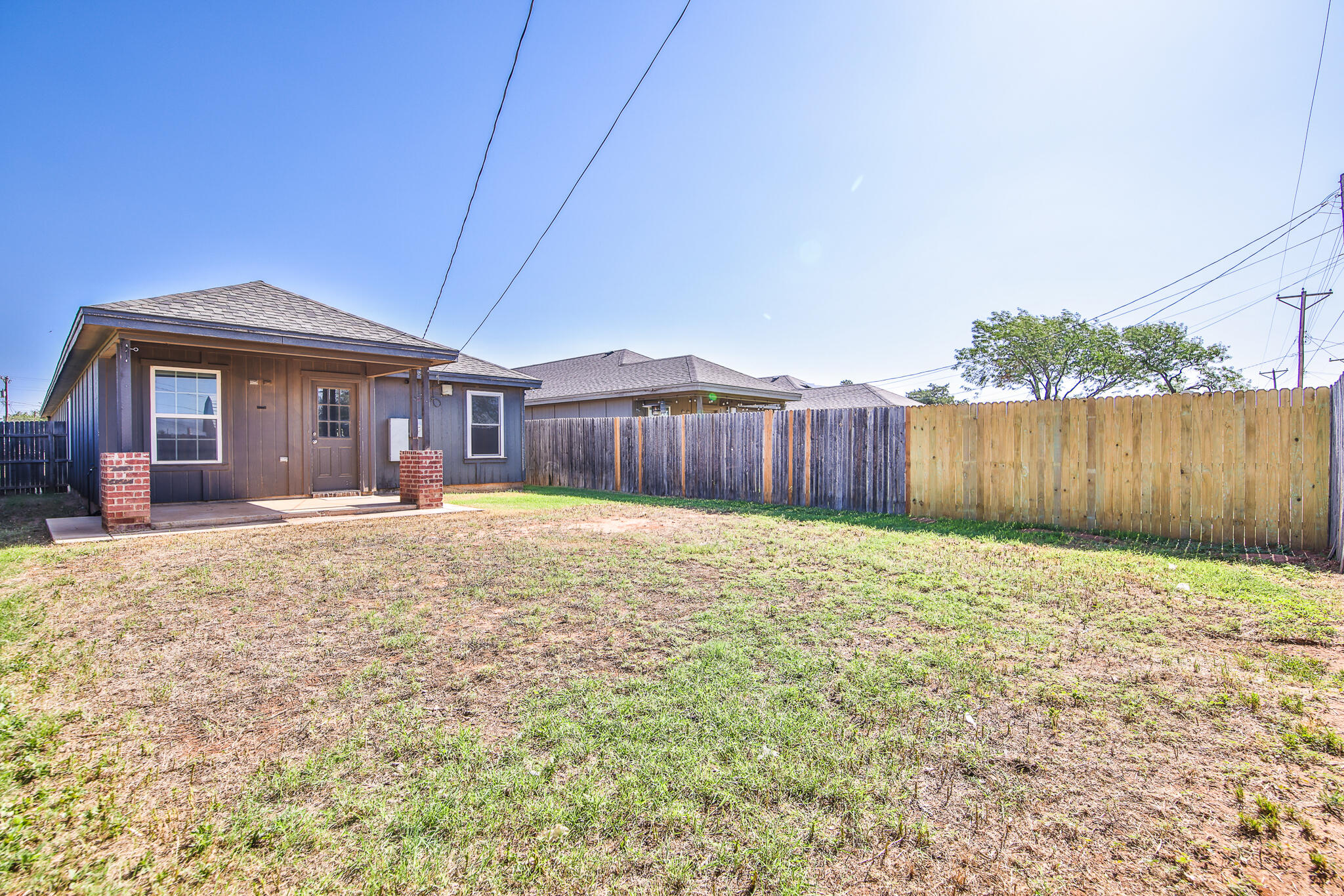 6205 21st Street Lubbock, TX 79407 - Photo 22 of 22 a front view of a house with a yard