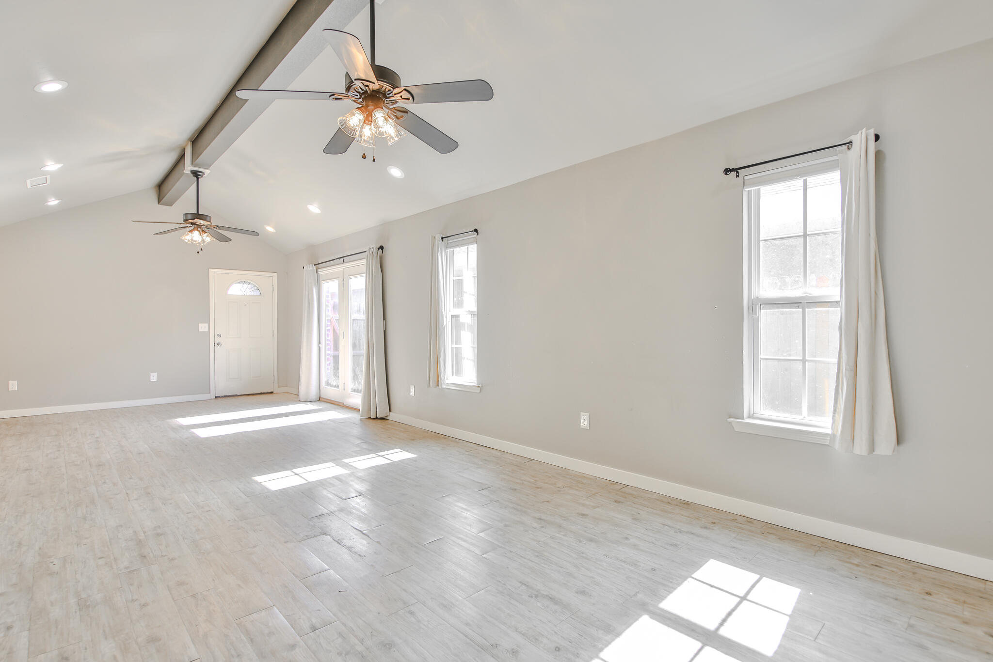 6205 21st Street Lubbock, TX 79407 - Photo 4 of 22 a view of an empty room with a window