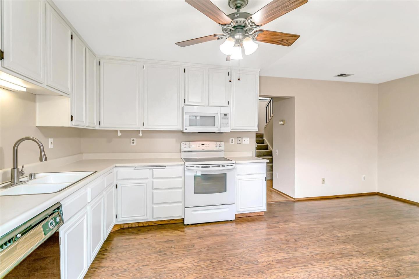 94 Saddlebrook Drive San Jose, CA 95136 - Photo 11 of 32 a kitchen with stainless steel appliances granite countertop a stove sink and cabinets