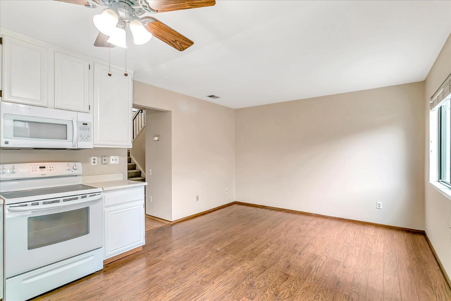 94 Saddlebrook Drive San Jose, CA 95136 - Photo 12 of 32 a kitchen with a stove a refrigerator and a microwave
