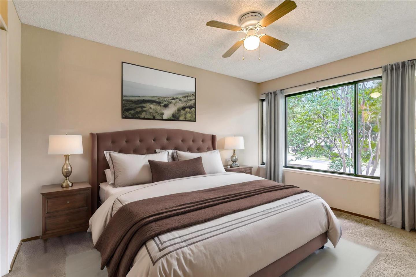 94 Saddlebrook Drive San Jose, CA 95136 - Photo 13 of 32 a bedroom with a large bed and a chandelier