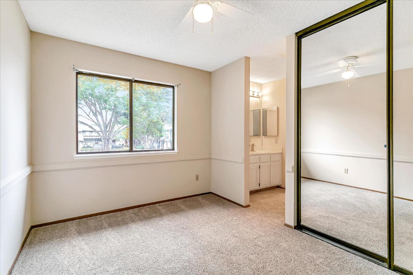 94 Saddlebrook Drive San Jose, CA 95136 - Photo 19 of 32 a view of empty room with window and refrigerator