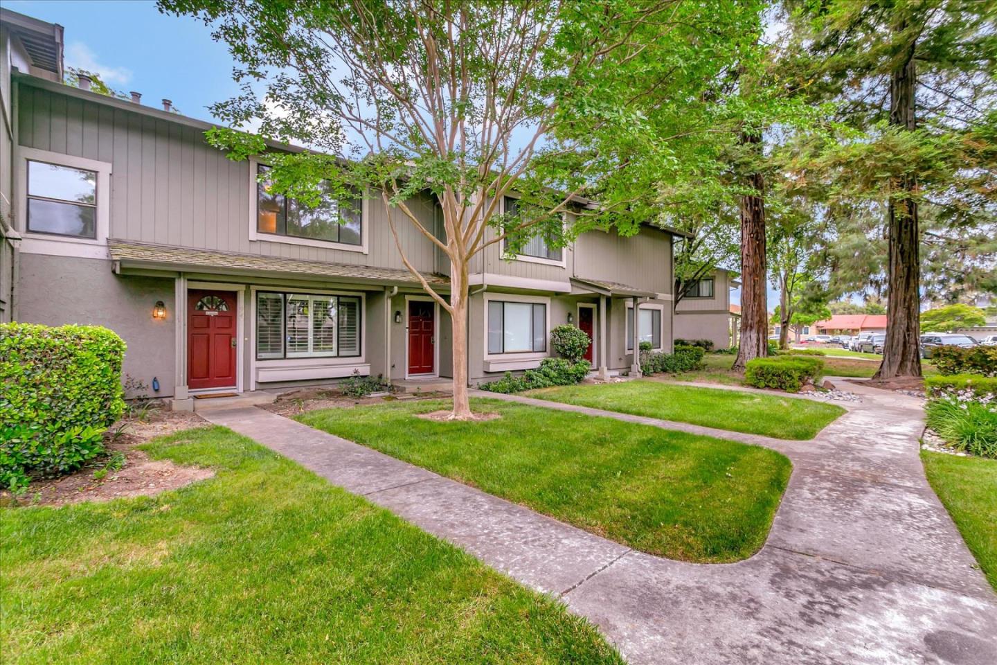 94 Saddlebrook Drive San Jose, CA 95136 - Photo 2 of 32 a front view of a house with a yard table and chairs
