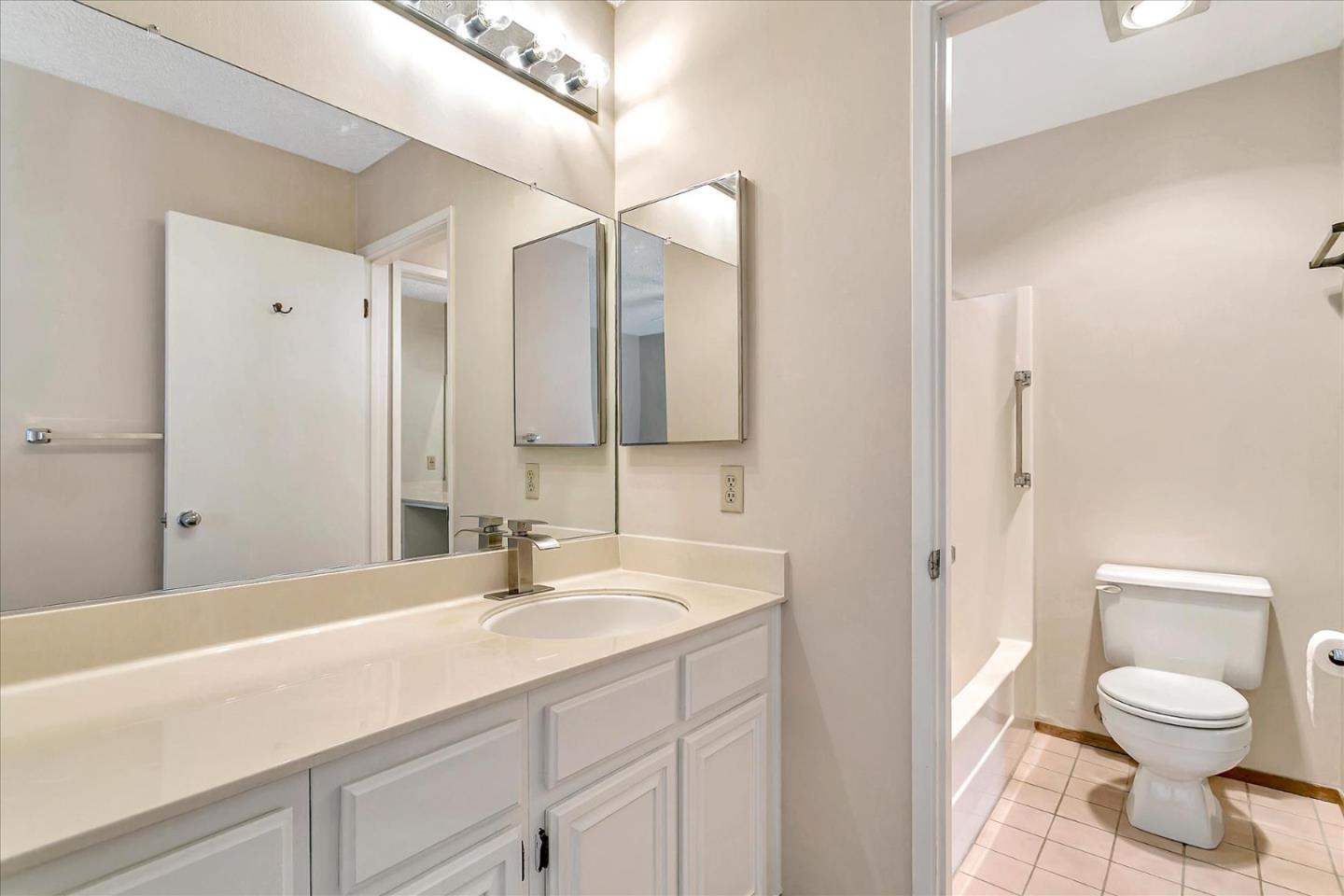 94 Saddlebrook Drive San Jose, CA 95136 - Photo 23 of 32 a bathroom with a toilet sink and mirror