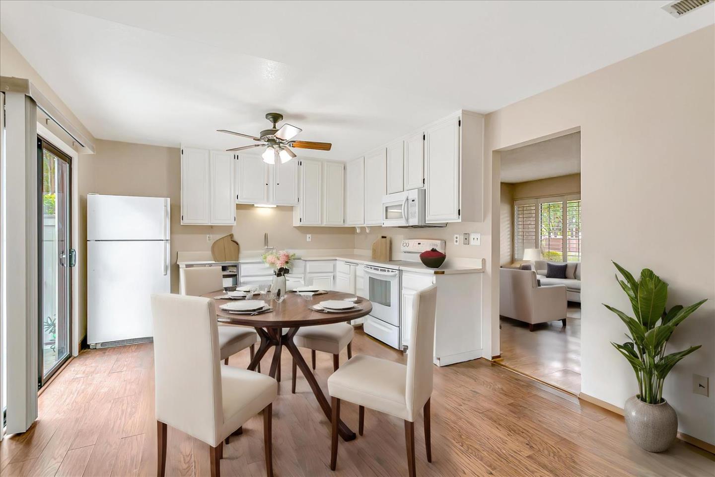 94 Saddlebrook Drive San Jose, CA 95136 - Photo 8 of 32 a kitchen with a table and chairs