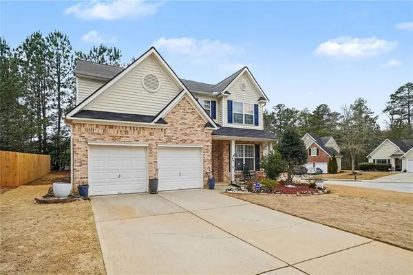 a front view of a house with a yard