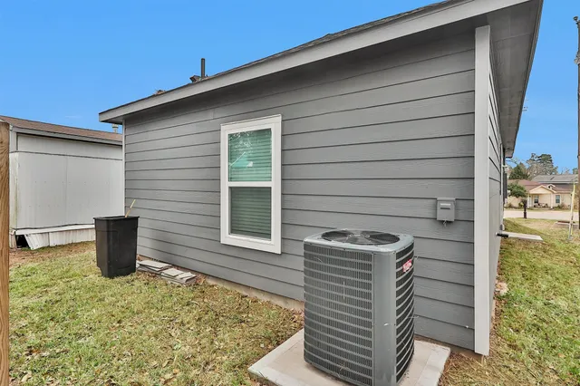 a view of house with outdoor seating