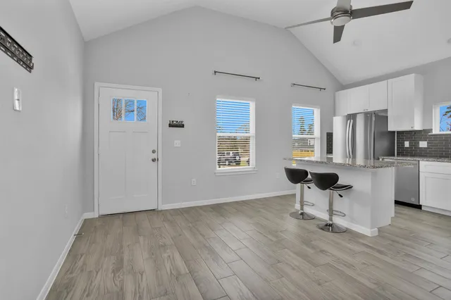 a living room with furniture and a table