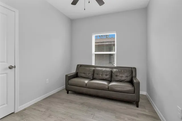 a living room with furniture and a window