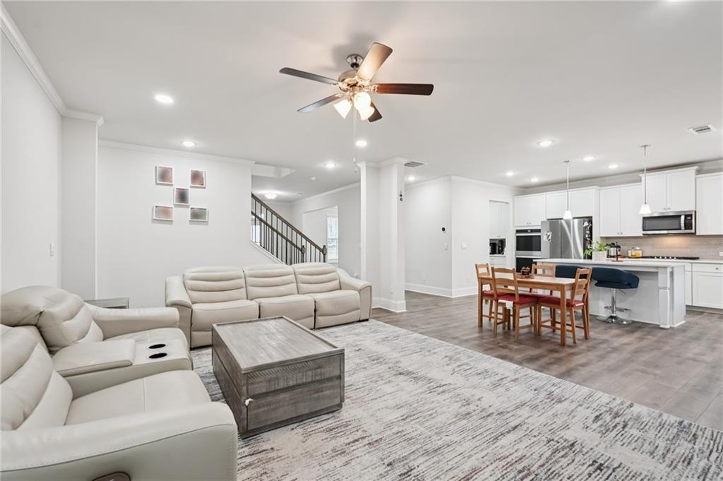 177 Treeline Trail Canton, GA 30115 - Photo 11 of 66 a living room with furniture kitchen view and a wooden floor