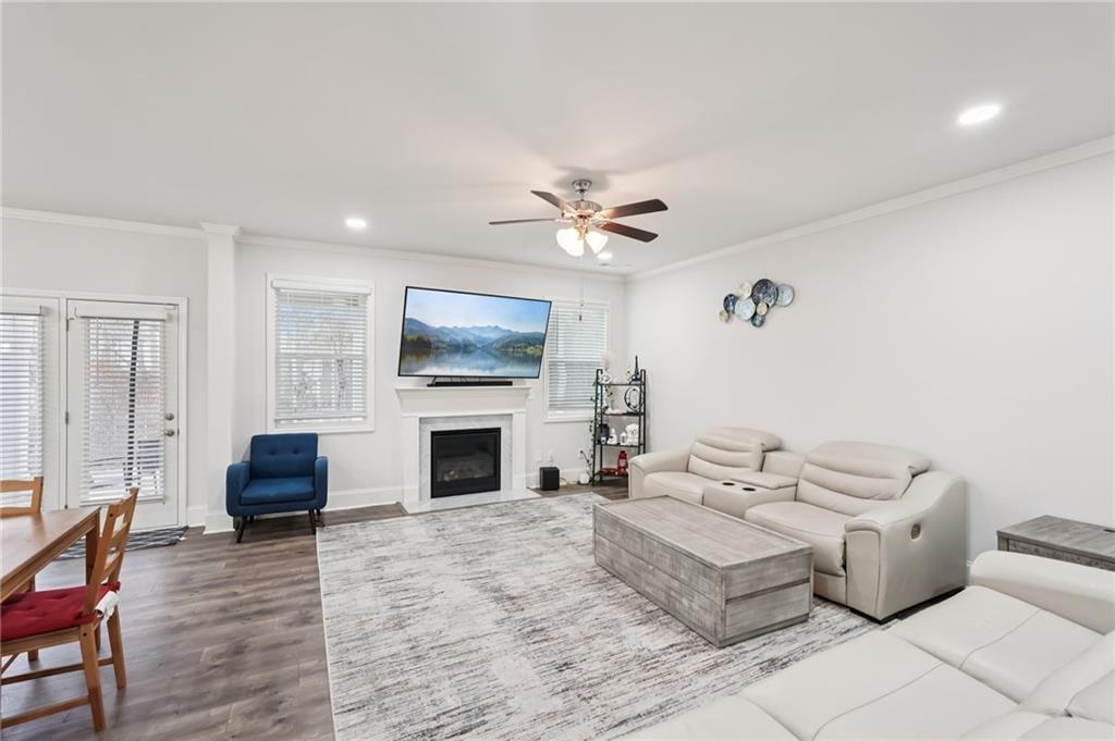 177 Treeline Trail Canton, GA 30115 - Photo 12 of 66 a living room with furniture and a fireplace