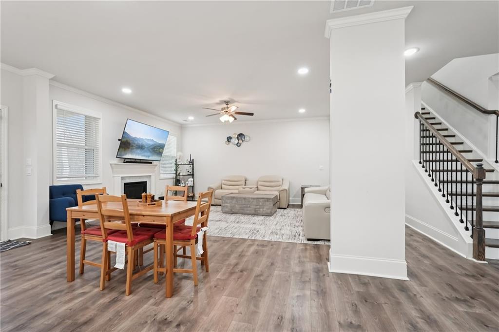 177 Treeline Trail Canton, GA 30115 - Photo 14 of 66 a view of a dining room with furniture and wooden floor