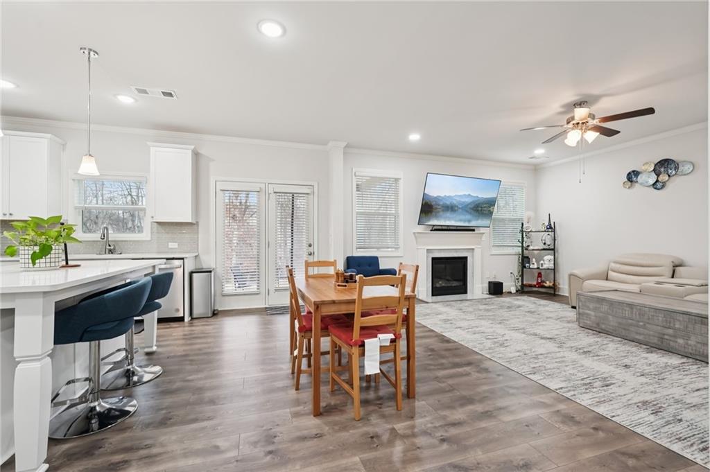 177 Treeline Trail Canton, GA 30115 - Photo 15 of 66 a view of a dining room with furniture window and wooden floor
