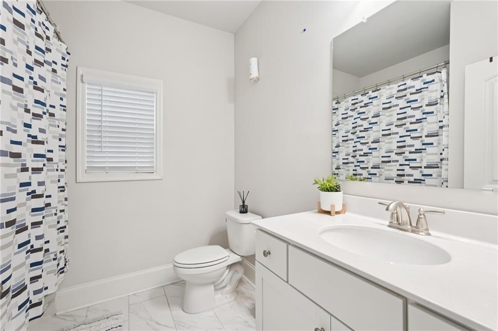 177 Treeline Trail Canton, GA 30115 - Photo 27 of 66 a bathroom with a granite countertop sink toilet and shower