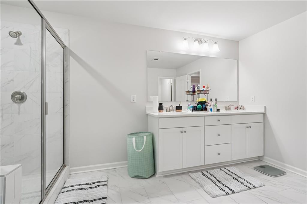 177 Treeline Trail Canton, GA 30115 - Photo 35 of 66 a spacious bathroom with a double vanity sink mirror and shower