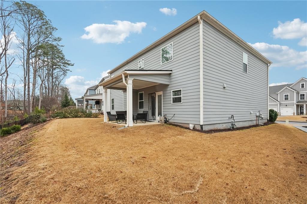 177 Treeline Trail Canton, GA 30115 - Photo 53 of 66 a view of a house with a yard and garage
