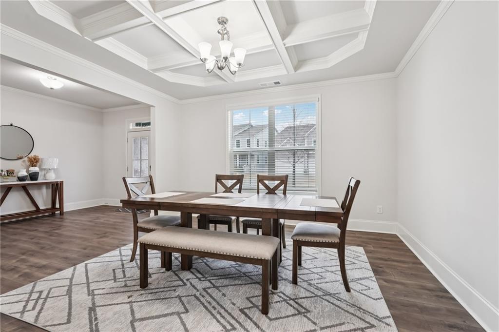 177 Treeline Trail Canton, GA 30115 - Photo 8 of 66 a view of a dining room with furniture and wooden floor