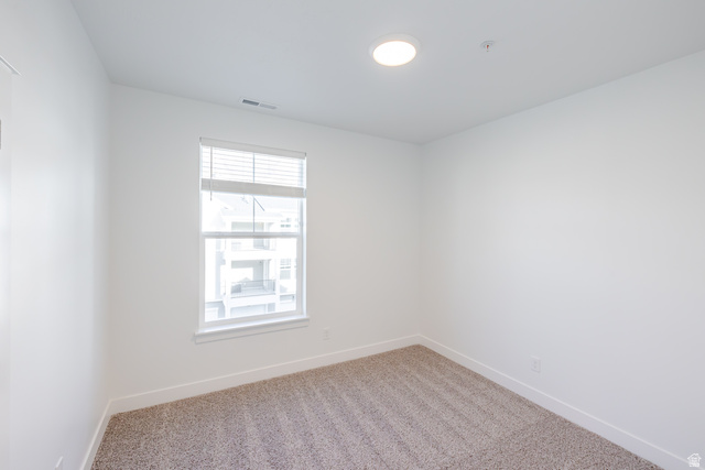 4662 Poplar Way, Unit Q303 Mapleton, UT 84664 - Photo 12 of 18 Spare room featuring light colored carpet and baseboards