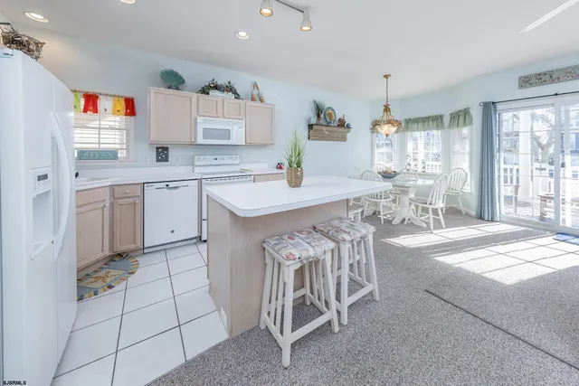 a dining table with chairs and window
